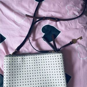 Cream color shoulder bag with love symbol by Fossil 1954